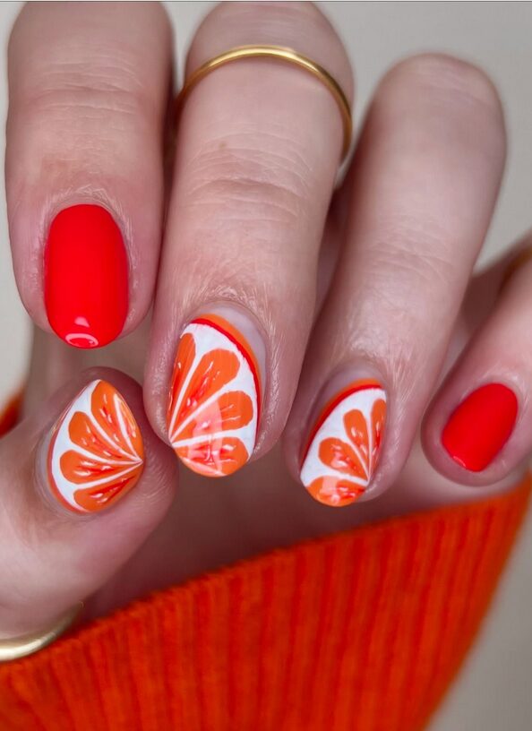 Orange nails with tiny citrus fruit art