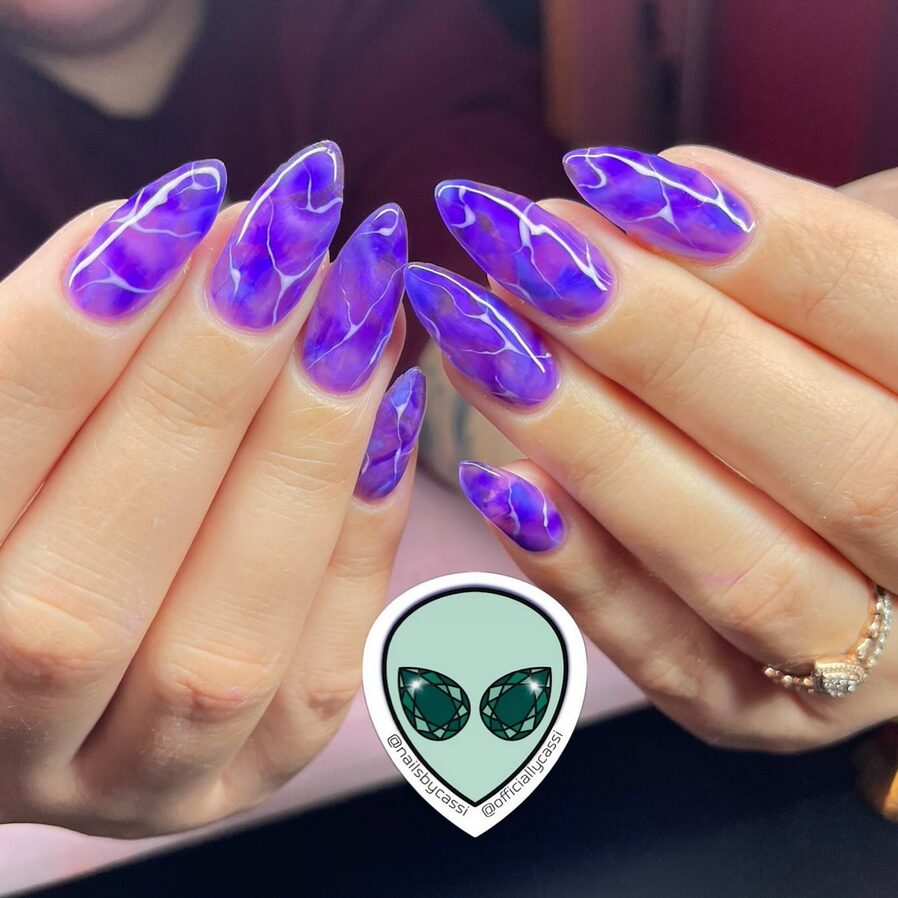 Purple lightning neon nails closeup