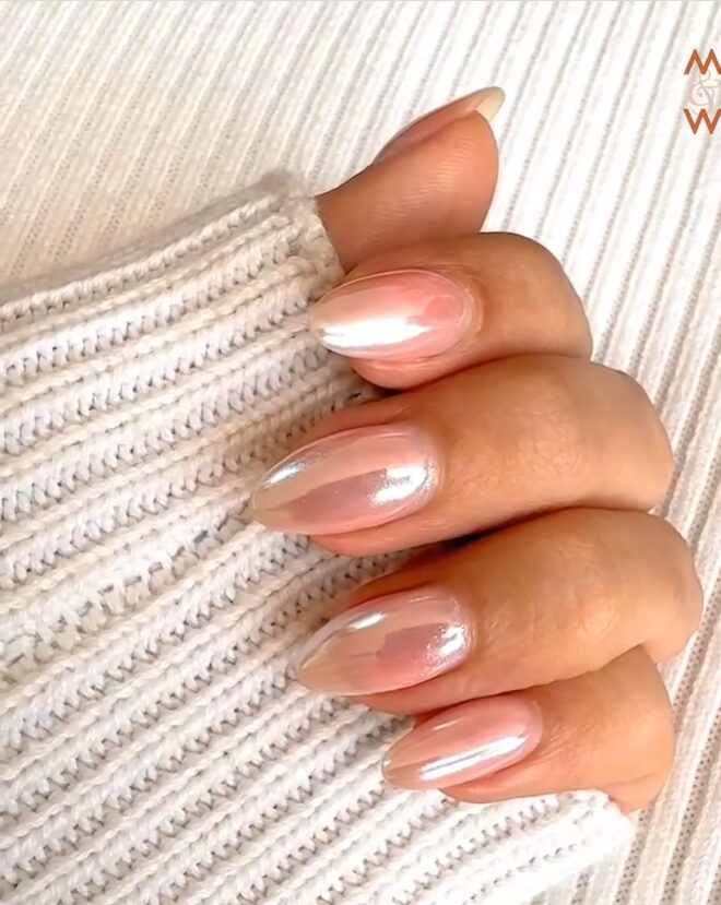 Soft pink almond nails with a sheer silver chrome sheen