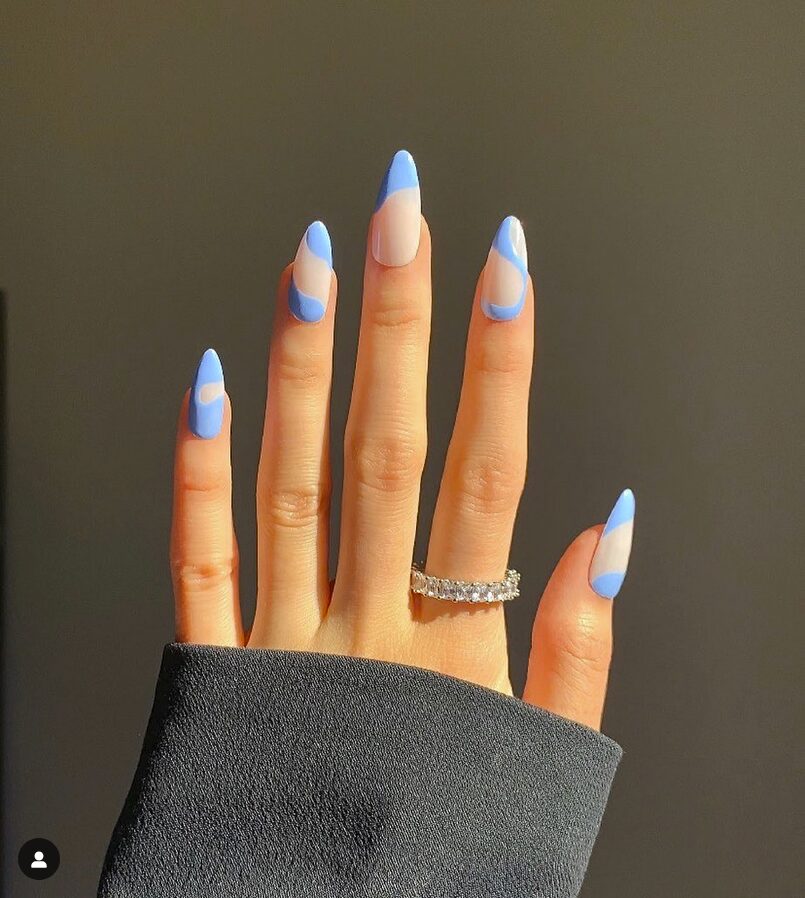 Sky-blue negative space nails with soft curved accents
