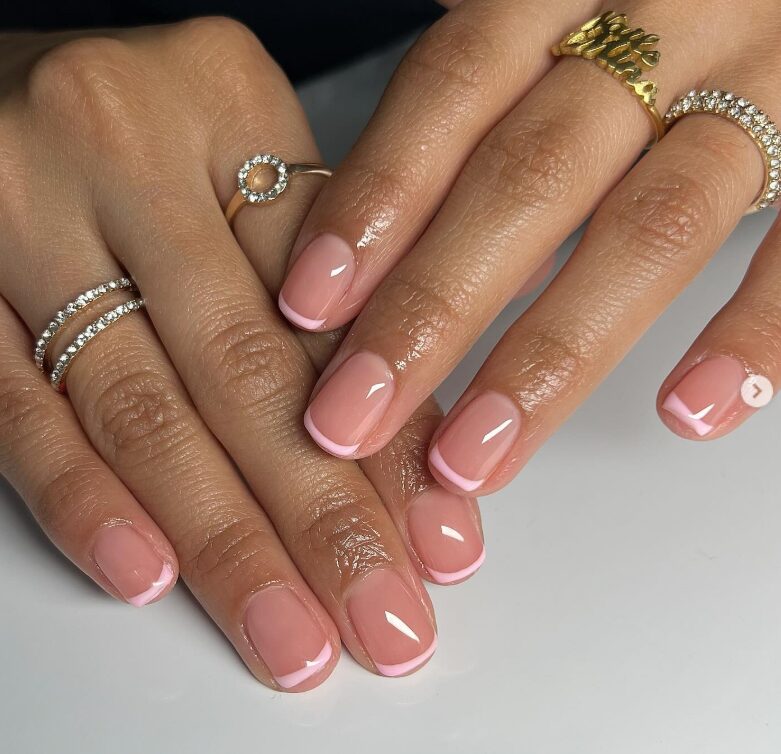 Short natural nails with classic French tips