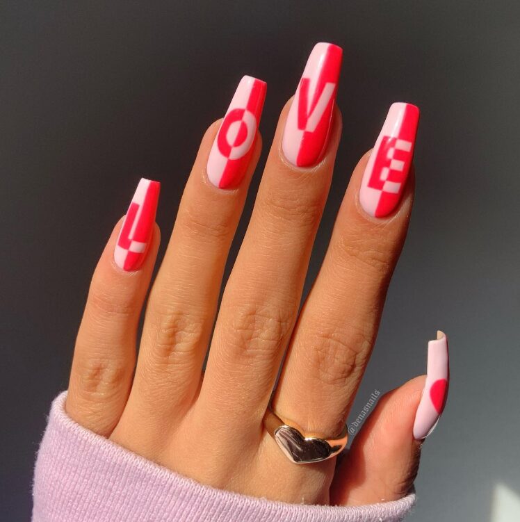 Hand with long square nails featuring a pink and white two-tone manicure