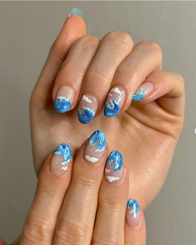 Sky blue wave nails with white cloud accents