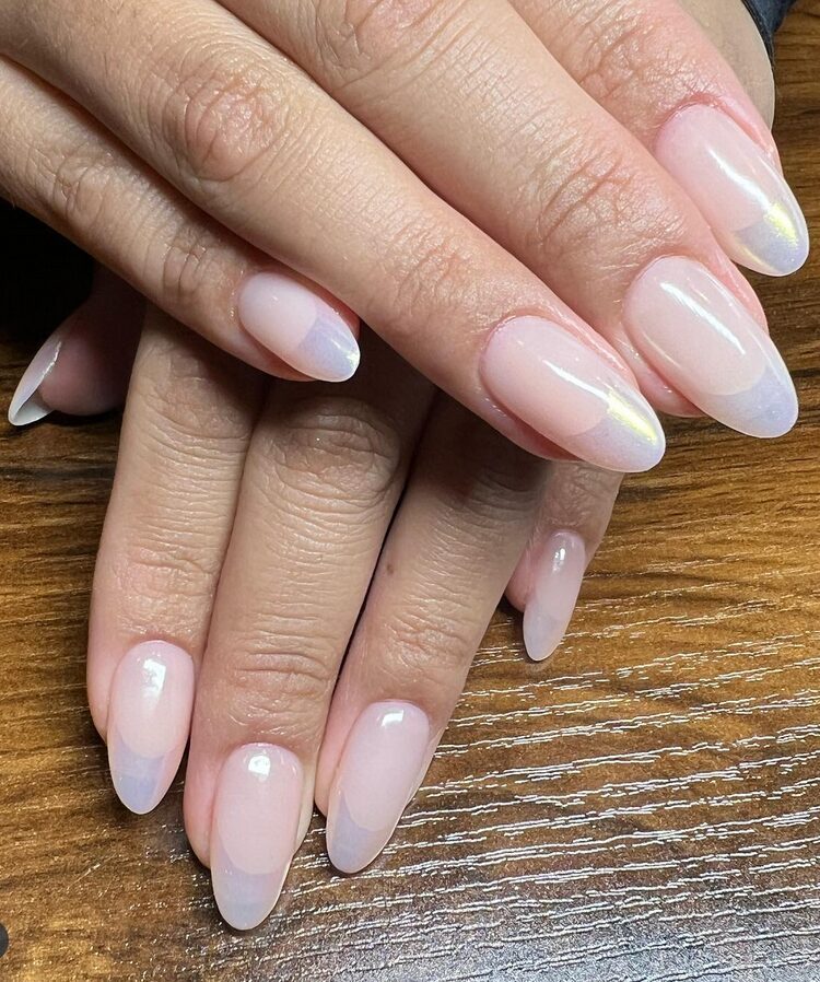 almond nails with a sheer white chrome gradient
