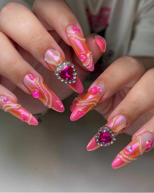 long pointed pink nails with jewels