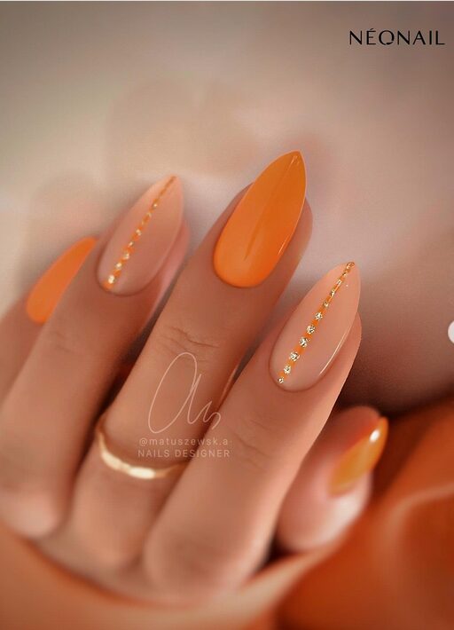 minimalist line nail art on orange nails