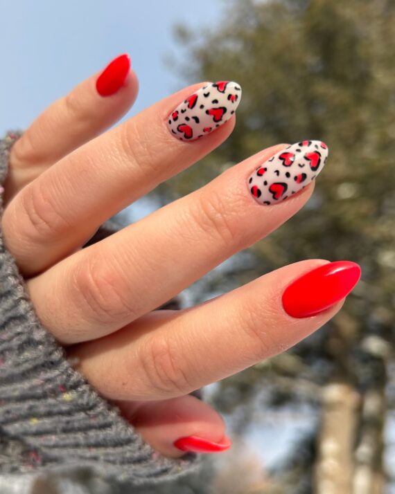nails with leopard-print heart accents
