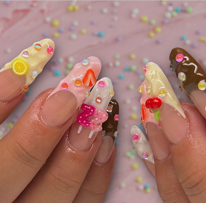 Pastel birthday nails with frosting and cake-inspired nail art