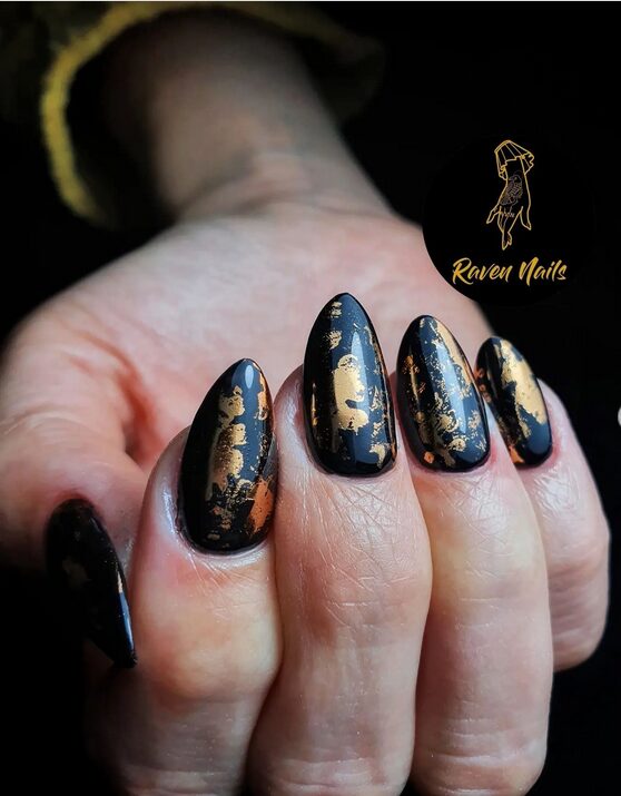 Matte black nails with copper and burnt orange accents