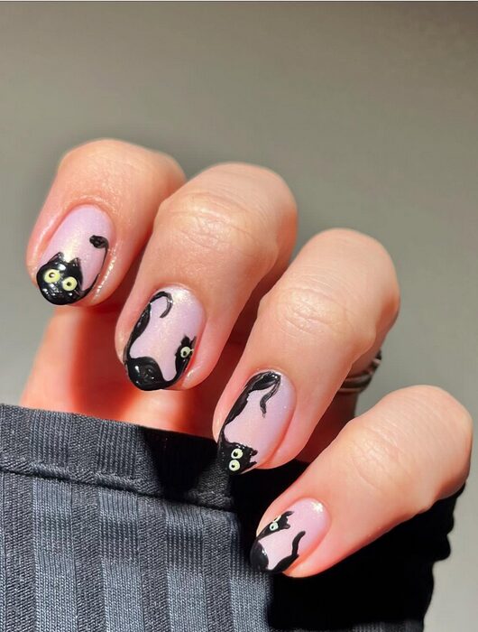 Nude nails with black cat designs