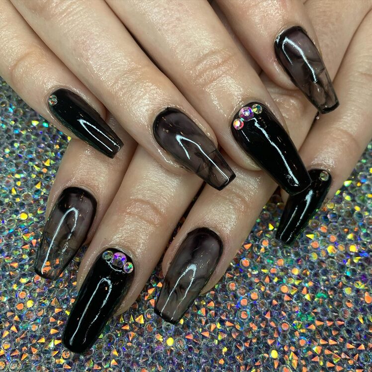 Glossy black coffin nails with gothic aesthetic