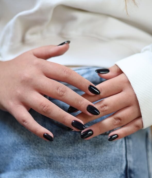 Velvet-textured black nails with glossy finish