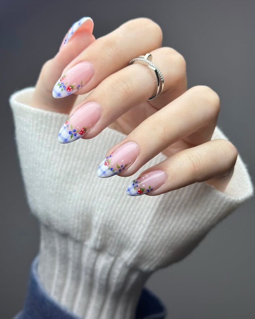 nails with blue gingham French tips and tiny colorful floral accents