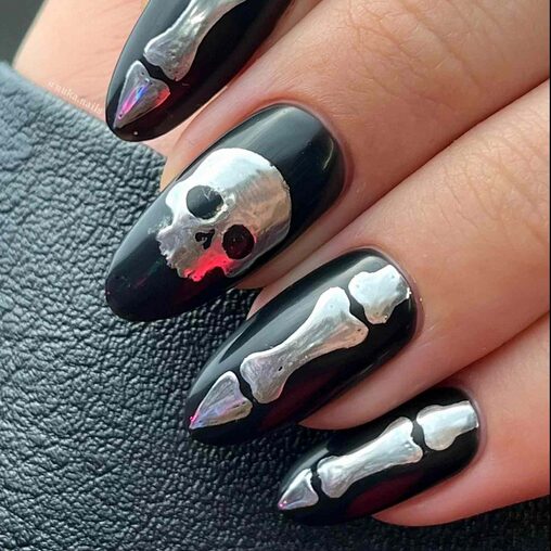 Bone art nails with skeletal and x-ray inspired designs in black and silver