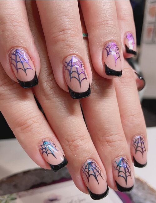 Chrome black nails with silver cobweb gothic design.
