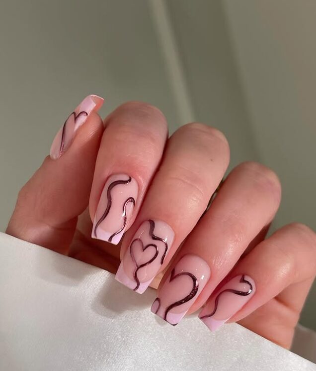 glossy red nails with melting heart drip art