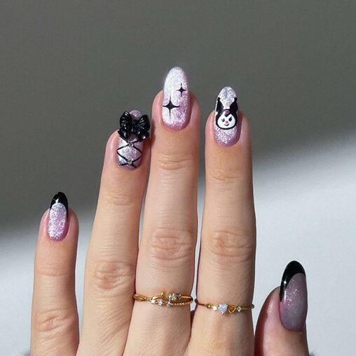 Girly goth nails with black polish, pink accents