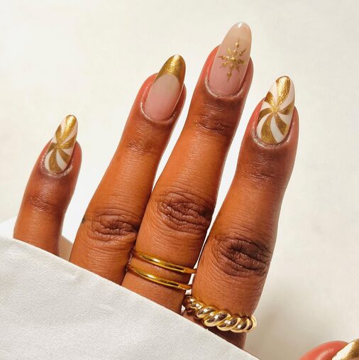 gold swirls candy cane manicure