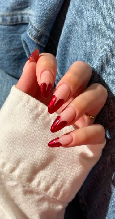 matching nails with half-heart designs that form a full heart