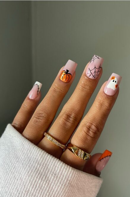 Halloween mix-and-match nails featuring different designs on each finger