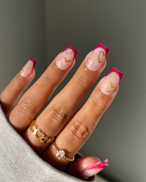 nude nails with small heart-shaped cutouts
