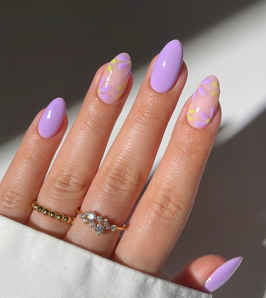 nails with glossy lavender pastel polish and delicate floral art