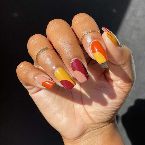Matte burnt orange manicure on coffin-shaped nails