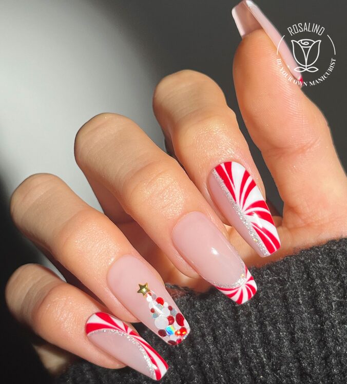 Nude minimalist nails with small red and white accents