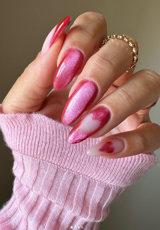 Pink shimmer nails with red heart accents