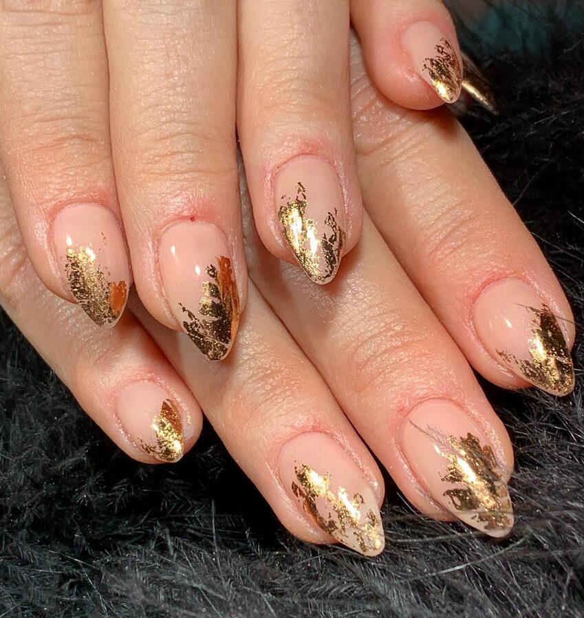 Nude nails with gold foil accents