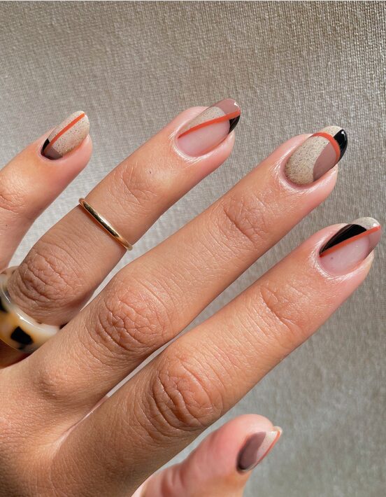 orange and burgundy color block nails