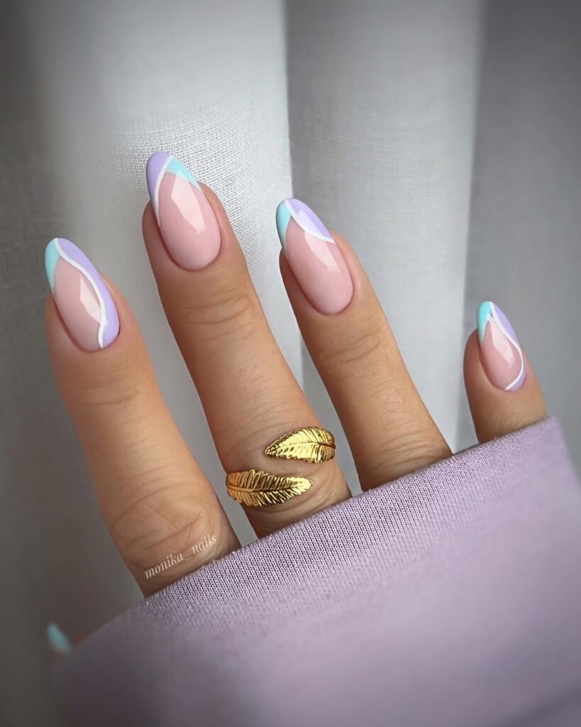 pastel lavender and baby blue abstract French tip manicure on a soft nude base
