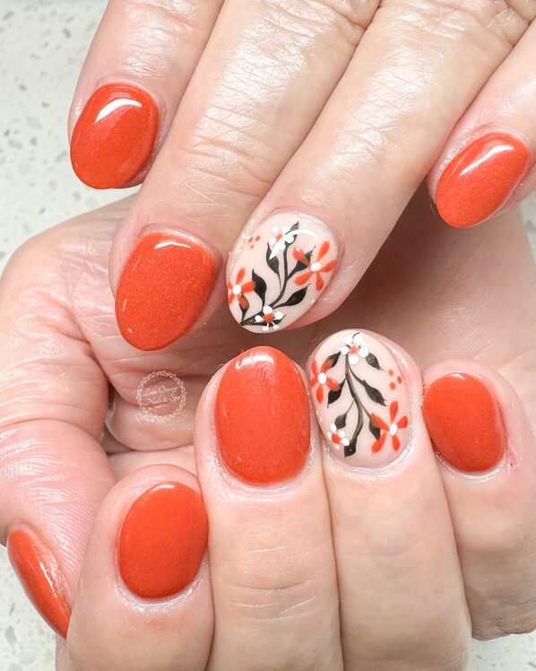 florals on a burnt orange base nails