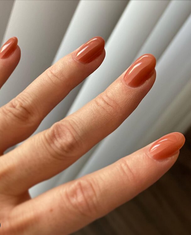 warm golden orange fall nail color
