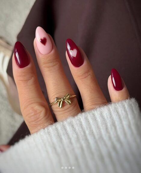 close-up of nails with small red heart designs