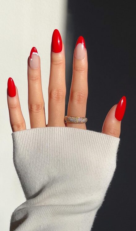 Short nails with Santa hat designs on the tips