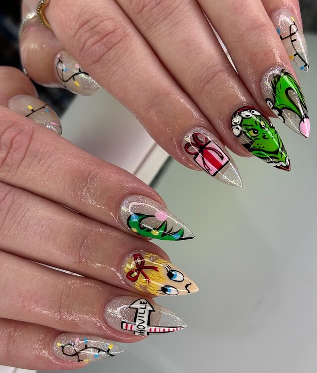 Whoville-inspired Christmas nail art with red, white, and green patterns