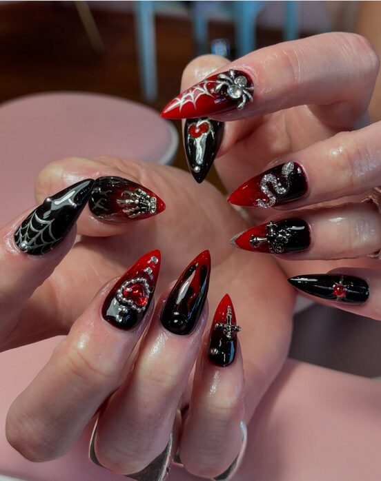 Dark black and red nails with spider web art in 3d