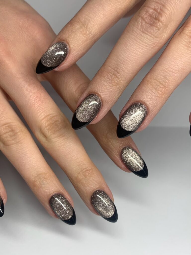 nails with champagne cat-eye shimmer base and glossy black French tips