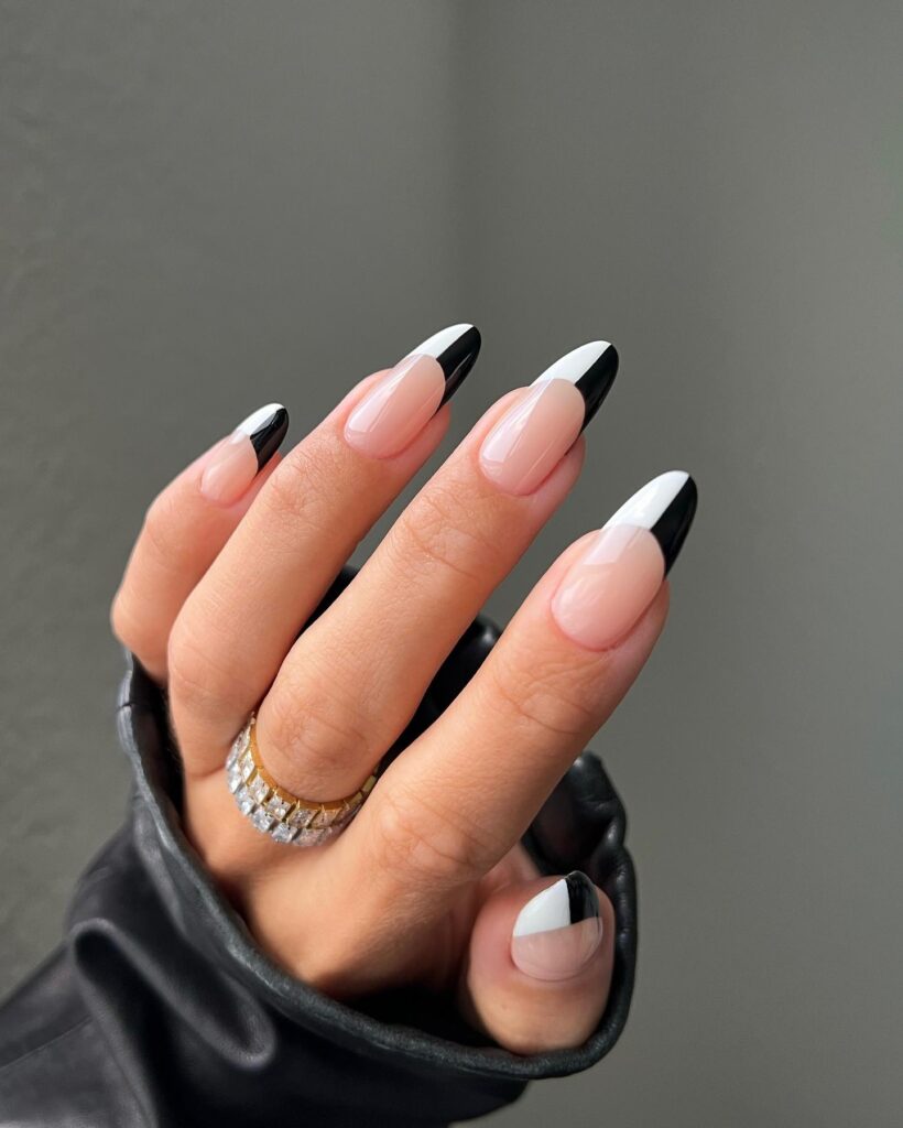 nails with split black and white French tips on natural nude base