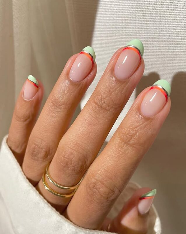 Mint green French tips with thin red accent lines on nude nails