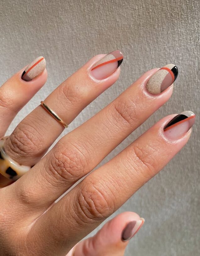 Neutral nails with geometric color-block French tips in black, beige, and terracotta