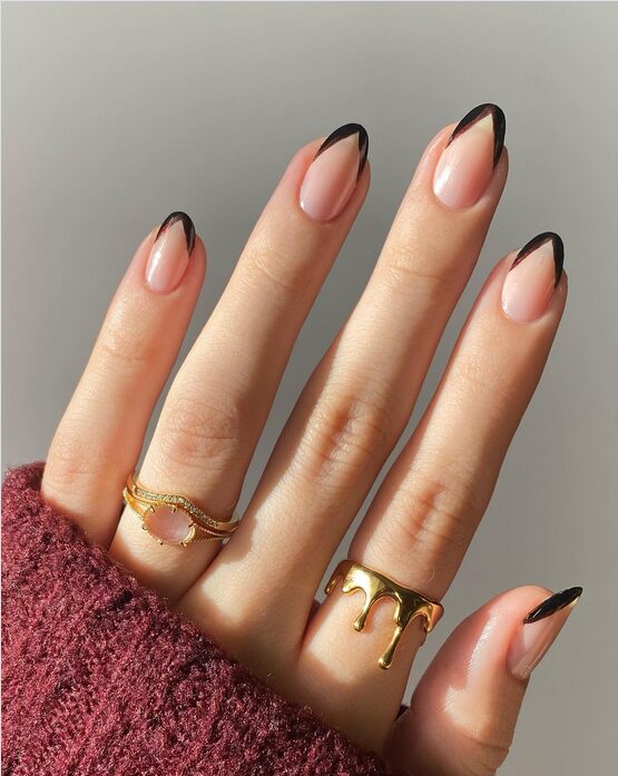 nails with black deep V-chevron French tips