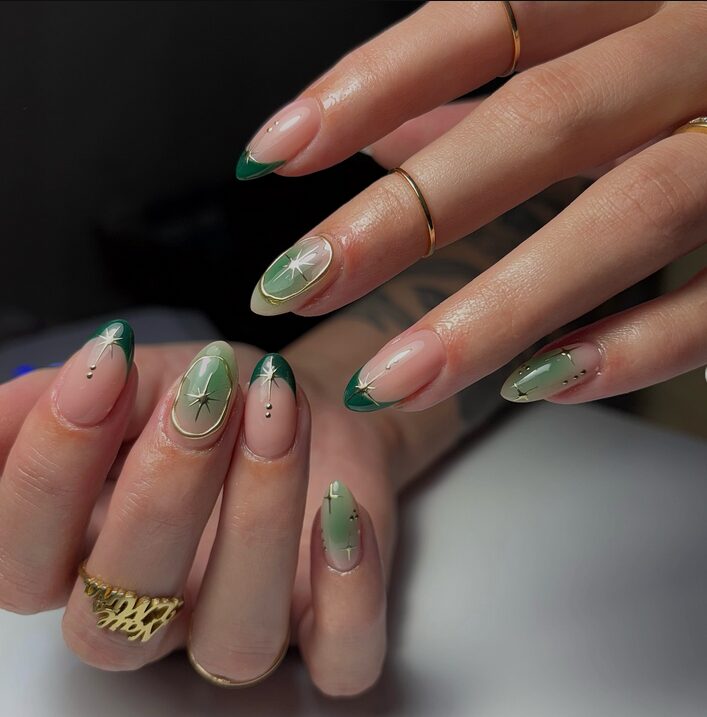 green french tip nails with gold star accents