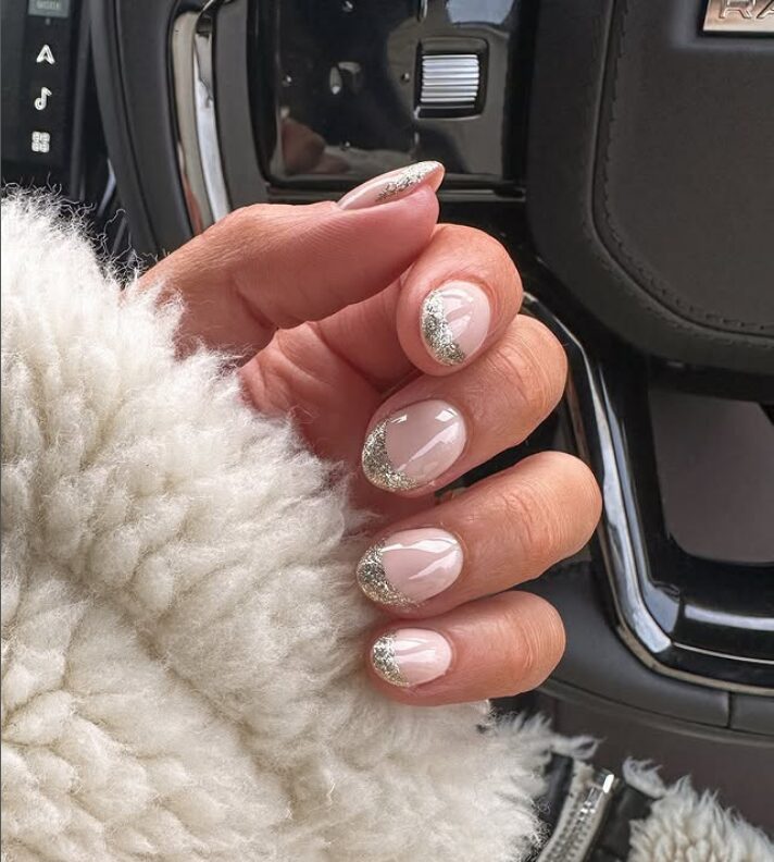 Short nude nails with silver glitter French tips