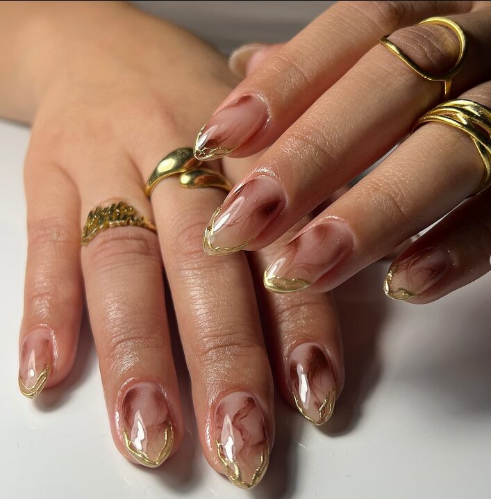 marble nails with gold vein French tips