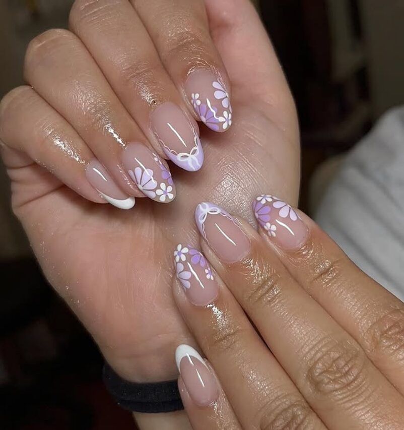 Lavender French tips with white floral designs