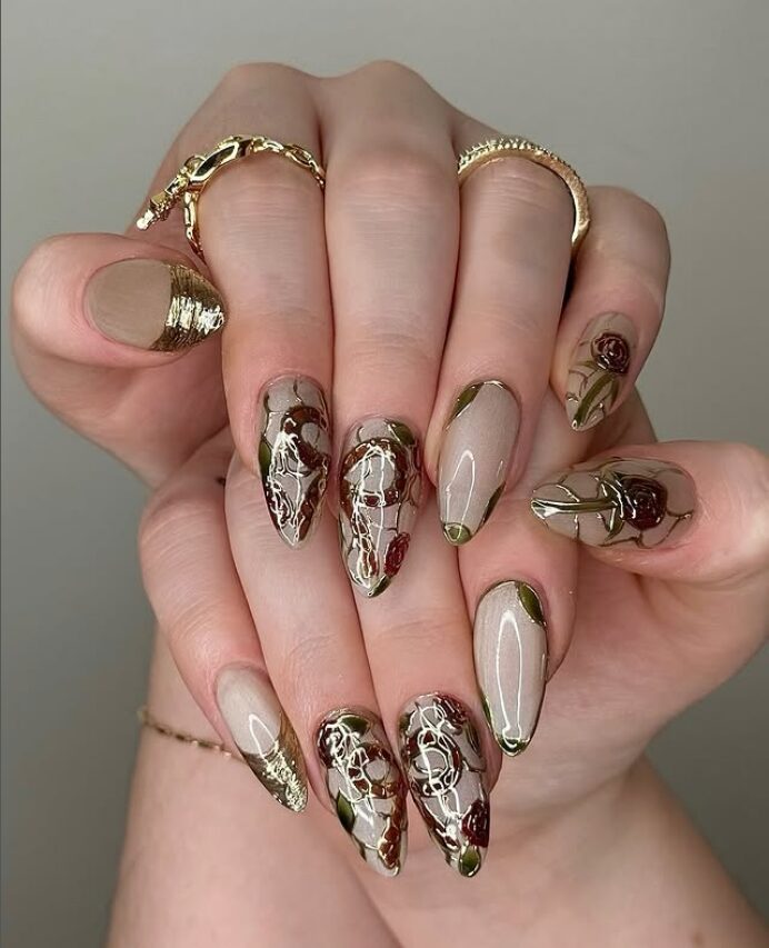 Beige nails with green French tips and stained-glass floral designs