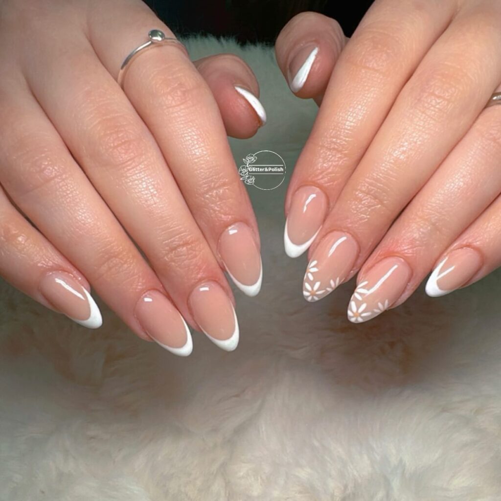 classic white French tips with daisy accent