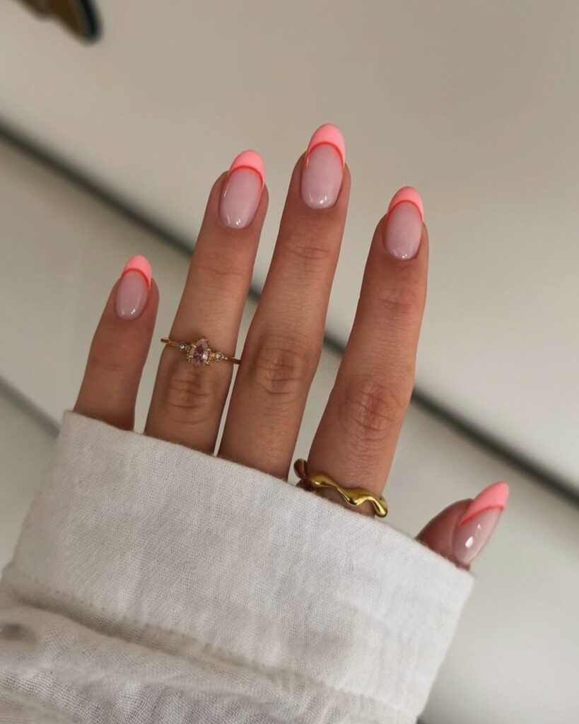 coral neon French tips in oval shape